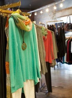 teal sweater with gold fashion necklace