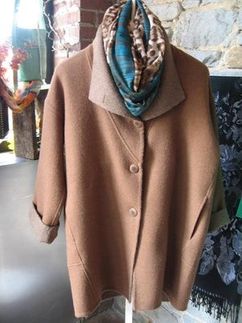 Woman’s brown coat and scarf